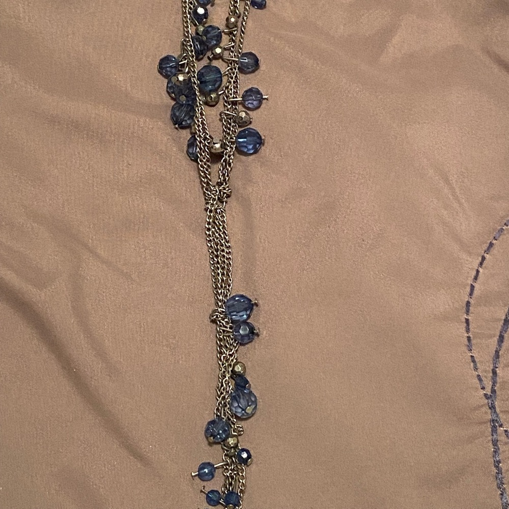Long silver & blue necklace.